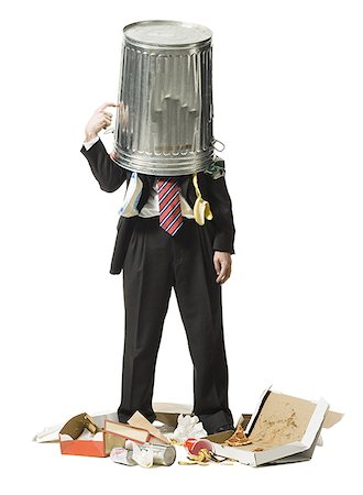 silhouette of businessman standing in office - Businessman with trash can on head Stock Photo - Premium Royalty-Free, Code: 640-01362904