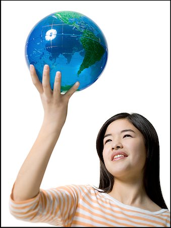 simulation - Close-up of a teenage girl holding a globe Foto de stock - Sin royalties Premium, Código: 640-01362935