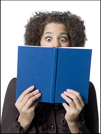 Girl with hardcover book Stock Photo - Premium Royalty-Free, Code: 640-01362978