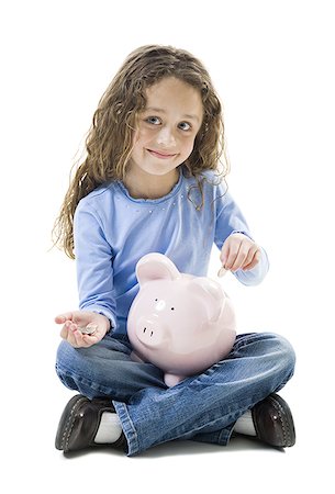simsearch:640-05760828,k - Close-up of a girl putting a coin into a piggy bank Stock Photo - Premium Royalty-Free, Code: 640-01363030