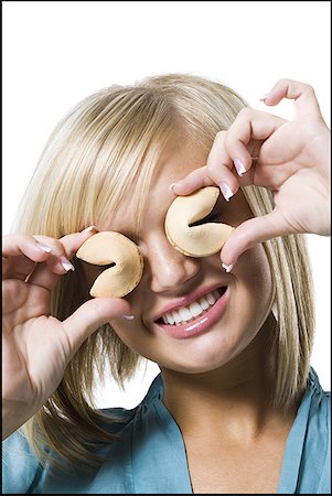 Woman with fortune cookies Foto de stock - Royalty Free Premium, Número: 640-01363073