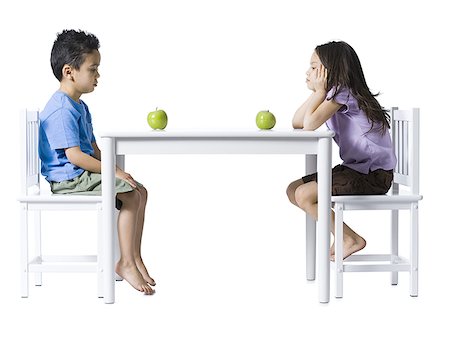 simsearch:640-02772735,k - Boy and girl sitting at table with green apples Stock Photo - Premium Royalty-Free, Code: 640-01363091