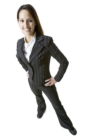shoe overhead on white - Portrait of a businesswoman standing with her hands on her hips Stock Photo - Premium Royalty-Free, Code: 640-01363115