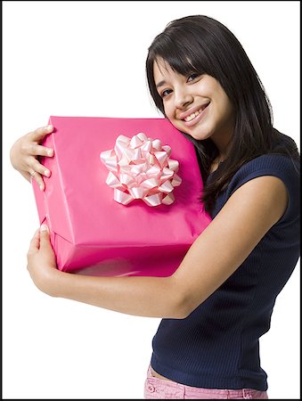 Close-up of a teenage girl holding a gift Foto de stock - Sin royalties Premium, Código: 640-01363203