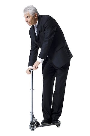 Businessman on a scooter Stock Photo - Premium Royalty-Free, Code: 640-01363295