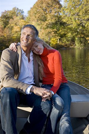 Portrait of a couple in a rowboat Stock Photo - Premium Royalty-Free, Code: 640-01363326