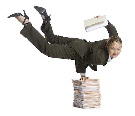 strong female acrobats - Female contortionist businesswoman Stock Photo - Premium Royalty-Free, Code: 640-01363355