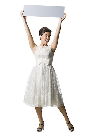 simsearch:640-01355807,k - Woman in white dress holding a blank sign Foto de stock - Sin royalties Premium, Código: 640-01363402