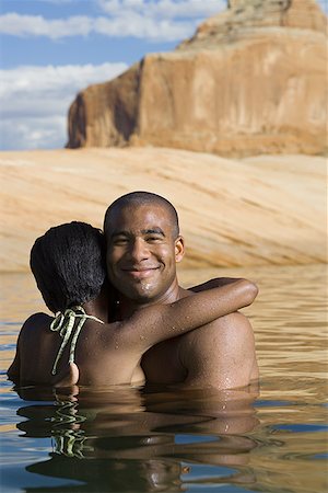 dulces - Young couple embracing in a lake Stock Photo - Premium Royalty-Free, Code: 640-01363452