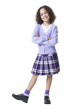 full height - Portrait of a girl standing with her arms crossed Stock Photo - Premium Royalty-Free, Code: 640-01363532