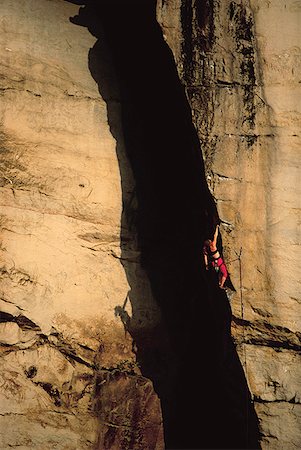 simsearch:640-01361581,k - Profile of a man rock climbing Fotografie stock - Premium Royalty-Free, Codice: 640-01363609