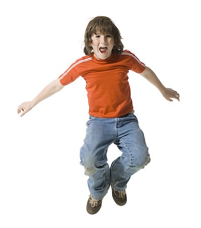 preteen boy happy white background - Portrait d'un jeune garçon plongeant dans l'air mid Photographie de stock - Premium Libres de Droits, Code: 640-01363709