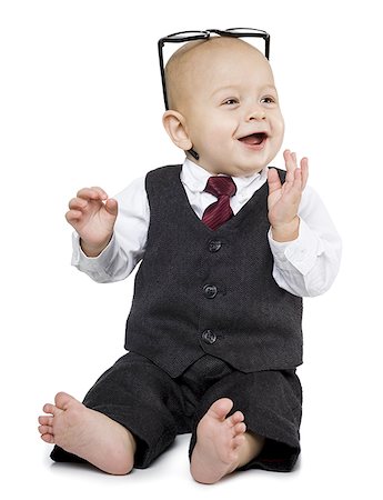silhouette of new born baby - Baby boy in business suit sitting Stock Photo - Premium Royalty-Free, Code: 640-01363717