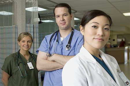 Portrait of two female doctors and a male doctor Stock Photo - Premium Royalty-Free, Code: 640-01363824
