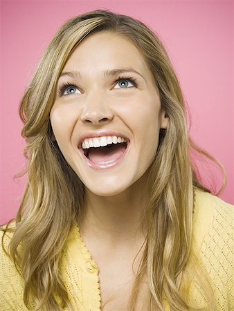 simsearch:640-01353835,k - Portrait of a woman smiling looking up Stock Photo - Premium Royalty-Free, Code: 640-01363894