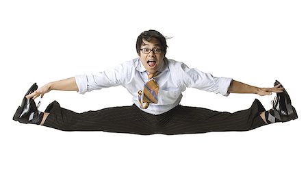 Portrait of a businessman jumping in midair Stock Photo - Premium Royalty-Free, Code: 640-01363988