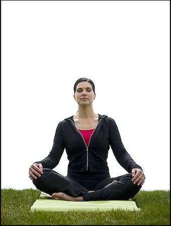 Femme faisant du yoga sur tapis de gazon Photographie de stock - Premium Libres de Droits, Code: 640-01458439