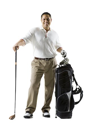 Man with golf club and bag smiling Stock Photo - Premium Royalty-Free, Code: 640-01458489