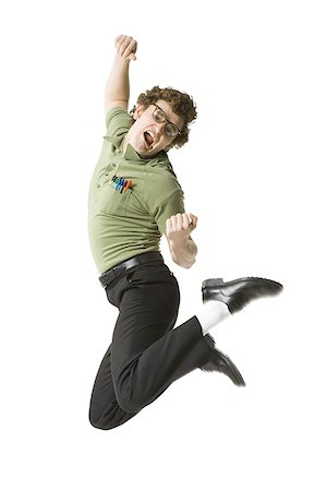 Male nerd with eyeglasses jumping and making funny face Stock Photo - Premium Royalty-Free, Code: 640-01458500