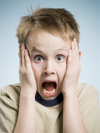 funny baby surprised expression - Boy with hands on face and mouth open surprised Stock Photo - Premium Royalty-Free, Code: 640-01458748