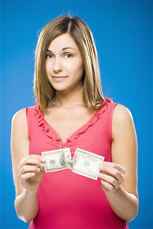simsearch:640-01458889,k - Femme déchirant le billet de cent dollars américains Photographie de stock - Premium Libres de Droits, Code: 640-01458875