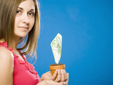 Woman holding euro money tree Fotografie stock - Premium Royalty-Free, Codice: 640-01458892