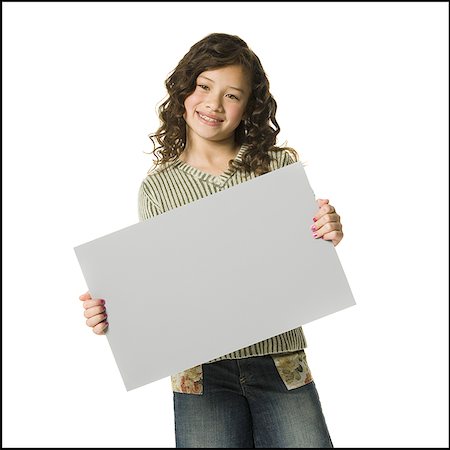 Girl with braces holding blank sign smiling Stock Photo - Premium Royalty-Free, Code: 640-01459083