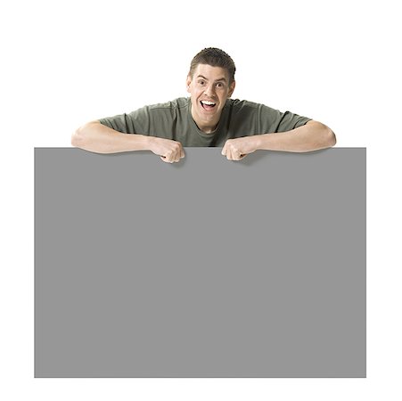 simsearch:640-01355807,k - Man holding blank sign Stock Photo - Premium Royalty-Free, Code: 640-01540415