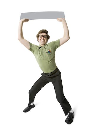 simsearch:640-03258417,k - Nerdy guy holding blank sign Stock Photo - Premium Royalty-Free, Code: 640-01540425