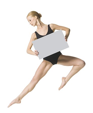 Dancer holding blank sign Stock Photo - Premium Royalty-Free, Code: 640-01540422