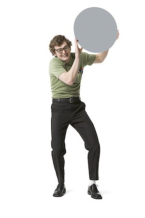 simsearch:640-03258417,k - Nerdy guy holding blank sign Stock Photo - Premium Royalty-Free, Code: 640-01540423