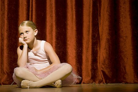 Ballerina girl sitting on stage sulking Stock Photo - Premium Royalty-Free, Code: 640-01575009