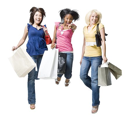 Three women with shopping bags smiling and leaping Stock Photo - Premium Royalty-Free, Code: 640-01575242