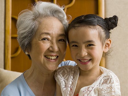 simsearch:640-01601434,k - Grandmother with granddaughter smiling Stock Photo - Premium Royalty-Free, Code: 640-01601419