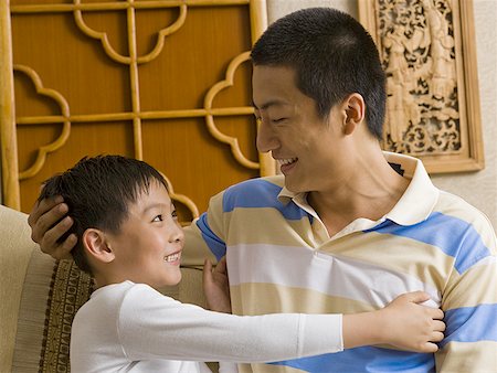 simsearch:640-01601434,k - Father and son embracing Stock Photo - Premium Royalty-Free, Code: 640-01601424