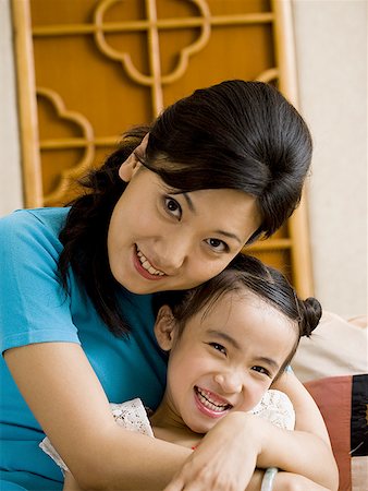 simsearch:640-01601434,k - Mother and daughter embracing and smiling Stock Photo - Premium Royalty-Free, Code: 640-01601433