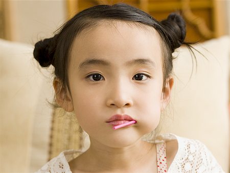 simsearch:640-03262770,k - Closeup of girl with lollipop in mouth Stock Photo - Premium Royalty-Free, Code: 640-01601448