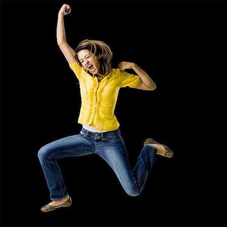 simsearch:640-01601608,k - Woman leaping with arms raised Stock Photo - Premium Royalty-Free, Code: 640-01601612