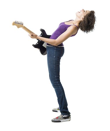 Girl playing electric guitar and singing Stock Photo - Premium Royalty-Free, Code: 640-01601623