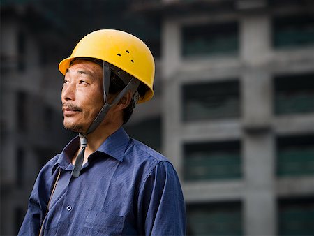 simsearch:640-01645400,k - Construction worker with helmet outdoors looking up Stock Photo - Premium Royalty-Free, Code: 640-01645346
