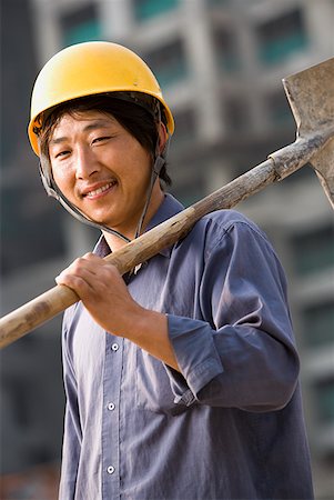 simsearch:640-03265269,k - Construction worker outdoors with helmet smiling Foto de stock - Sin royalties Premium, Código: 640-01645386