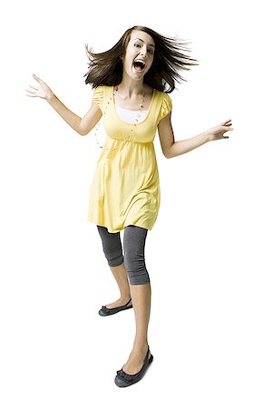 simsearch:640-03259872,k - Teenage girl dancing et souriant Photographie de stock - Premium Libres de Droits, Code: 640-01645727