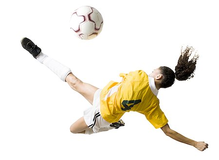 diving (not water) - Teenage girl kicking soccer ball Foto de stock - Sin royalties Premium, Código: 640-01645754