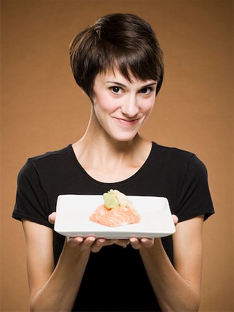 simsearch:640-01645781,k - Woman holding sushi smiling Stock Photo - Premium Royalty-Free, Code: 640-01645790
