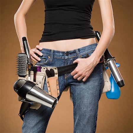 Mid section view of hairdresser with tool belt Foto de stock - Sin royalties Premium, Código: 640-01645803