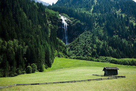 pictures scenery waterfalls hills - Cabin in valley with mountains and waterfall Stock Photo - Premium Royalty-Free, Code: 640-01645830