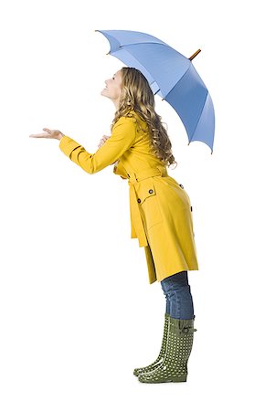 person and raincoat and umbrella - young woman holding an umbrella. Stock Photo - Premium Royalty-Free, Code: 640-02655751