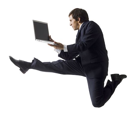 businessman jumping in the air Stock Photo - Premium Royalty-Free, Code: 640-02655796