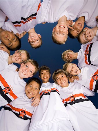 young soccer players in a circle Stock Photo - Premium Royalty-Free, Code: 640-02655806