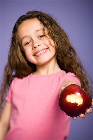 simsearch:640-02656973,k - Girl eating apple Fotografie stock - Premium Royalty-Free, Codice: 640-02655962